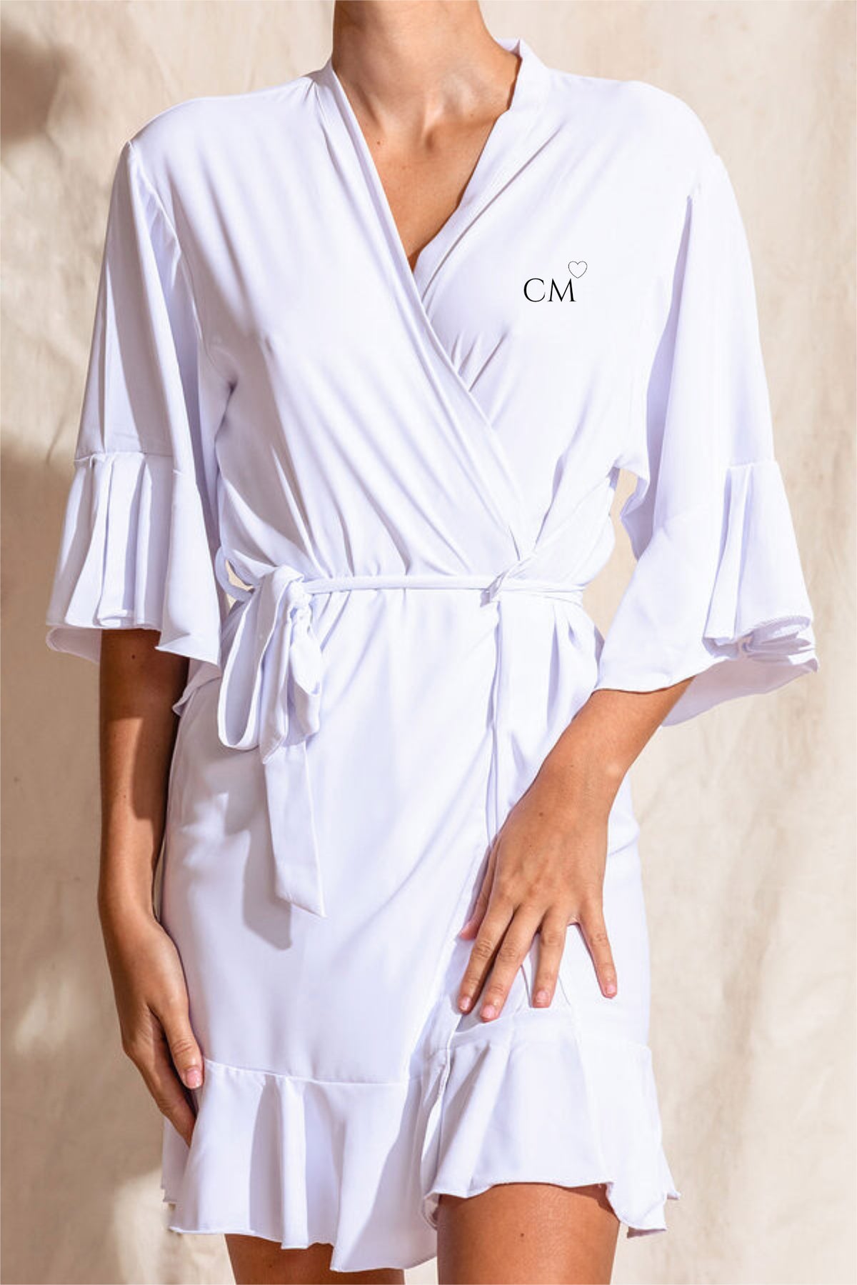 White crepe satin bridal robe with ruffle hem and sleeves, front personalised with bride's initials and heart detail